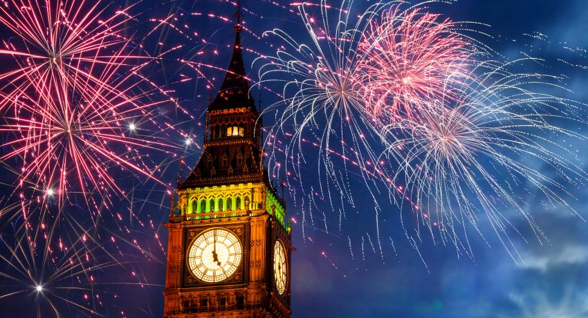 New Year in the city. Explosive fireworks display fills the sky around Big Ben, Westminster, London, UK. Celebration or holiday background